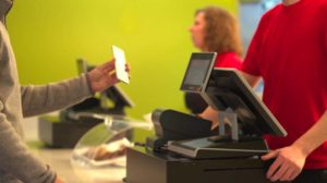 A customer scans their customer loyalty app